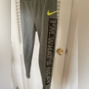 Girls Nike gray cropped leggings, size Small/5, Nike logo and print on left leg